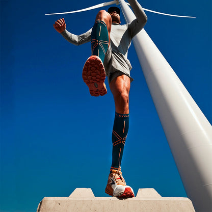 Person in the air with his legs wide.